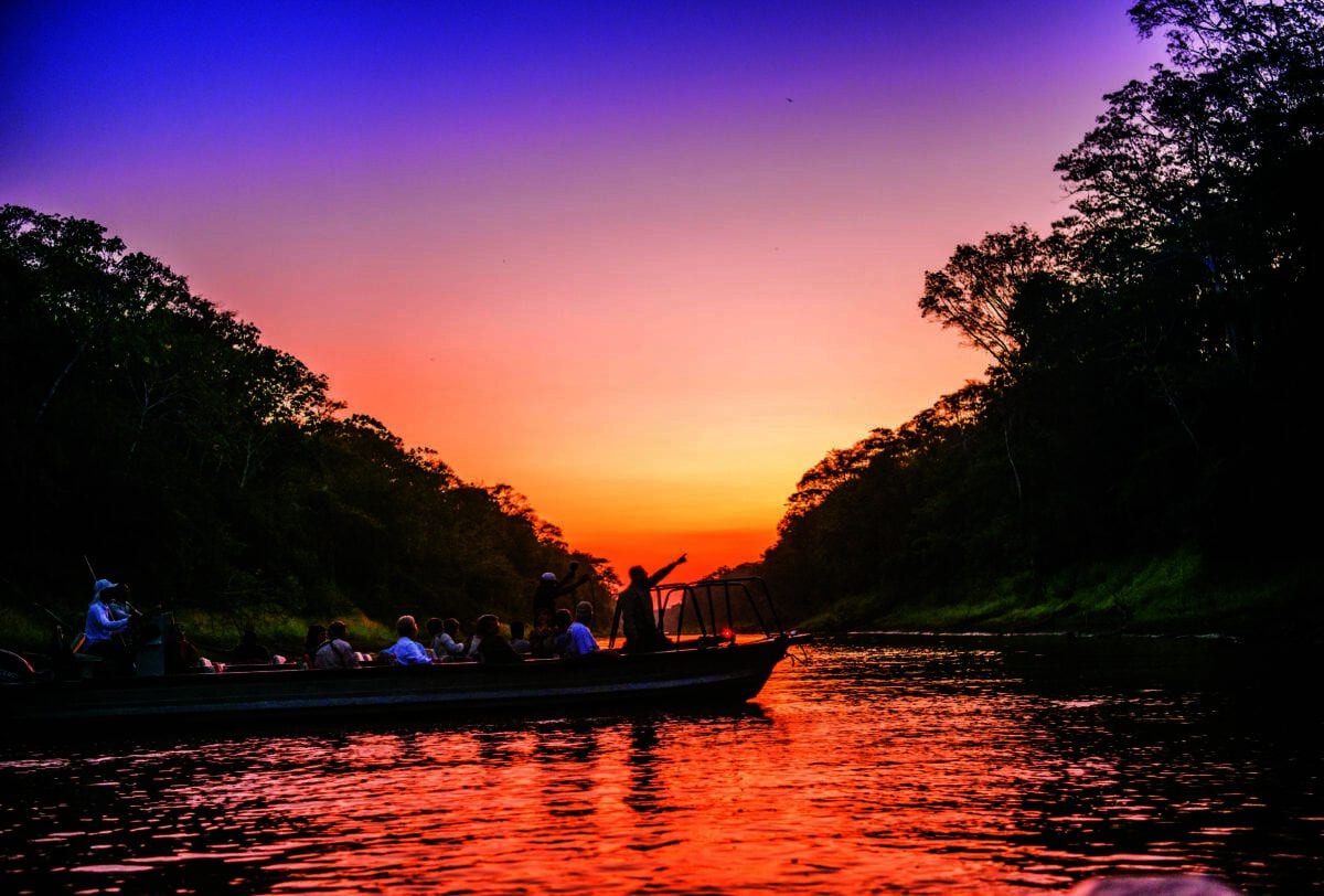 Guests explore the Amazon Dorado River at night by Skiff, Argentina