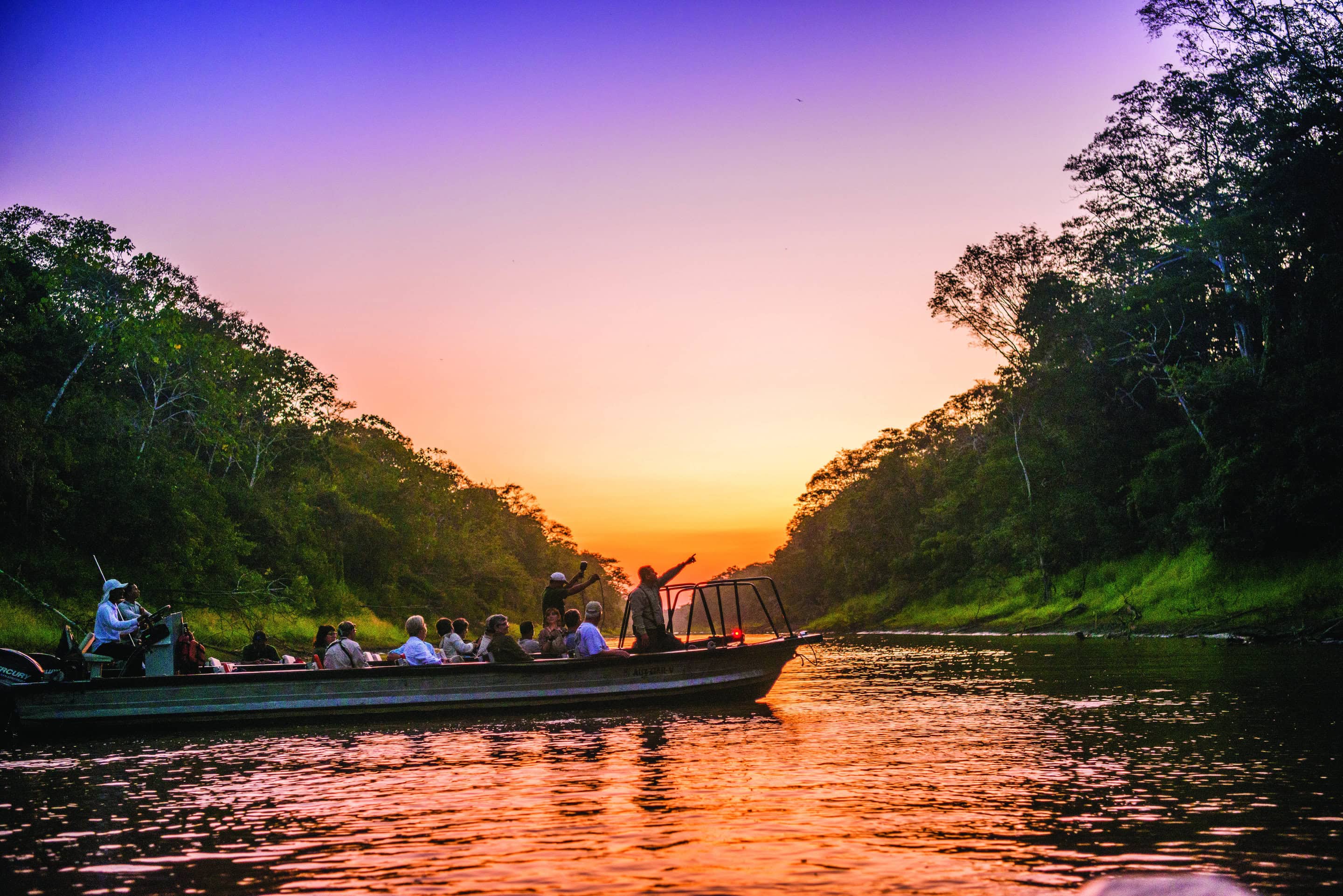 Guests explore the Amazon Dorado River at night by Skiff, Argentina